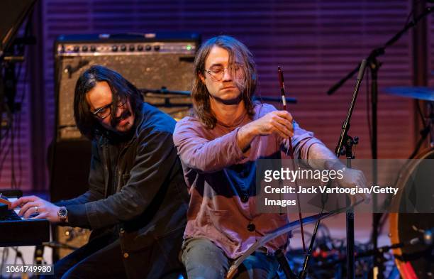 American Folk musicians Jeff Prystowsky , on electric piano, and Ben Knox Miller, on musical saw, perform with their band the Low Anthem during a...