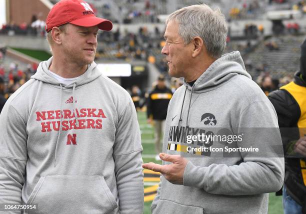 Nebraska Cornhuskers football coach talks with Iowa Hawkeyes football coach before a Big Ten Conference football game between the Nebraska...