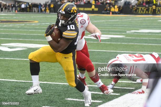 Nebraska Cornhuskers defensive end Mick Stoltenberg tries to tackle Iowa Hawkeyes running back Mekhi Sargent during a Big Ten Conference football...