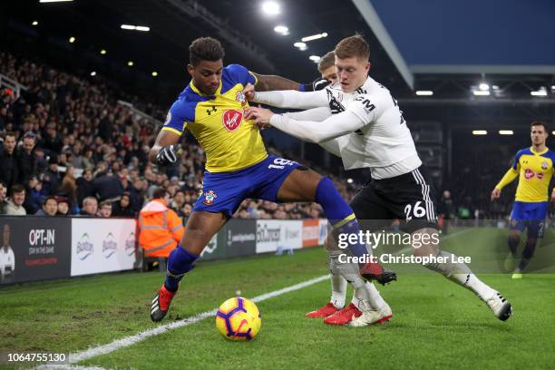 Mario Lemina of Southampton battles for possession with Alfie Mawson of Fulham during the Premier League match between Fulham FC and Southampton FC...