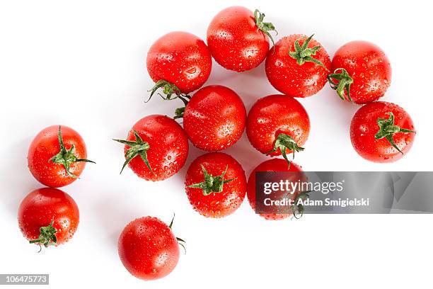 wet red cherry tomatoes isolated on white - cherry tomato stock pictures, royalty-free photos & images