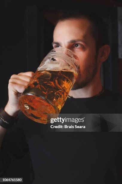 man drinking beer - lager stock pictures, royalty-free photos & images