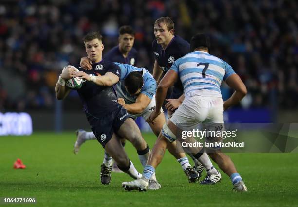 Huw Jones of Scotland is tackled by Martin Landajo of Argentina during the International Friendly match between Scotland and Argentina at Murrayfield...