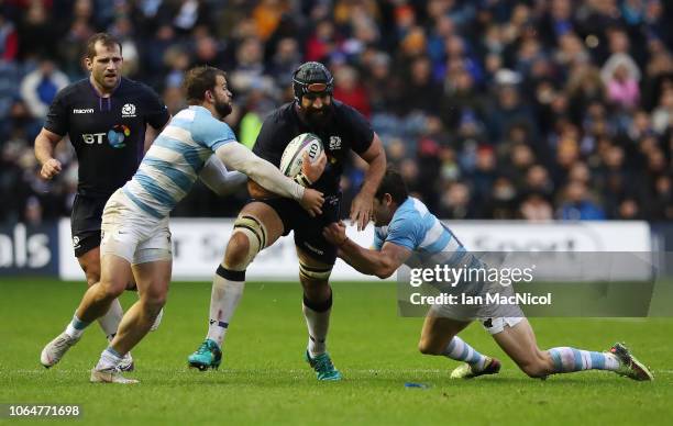 Josh Strauss of Scotland is tackled by Nicolas Sanchez of Argentina during the International Friendly match between Scotland and Argentina at...