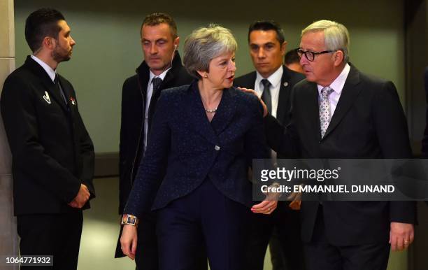 Commission President Jean-Claude Juncker welcomes Britain's Prime Minister Theresa May for Brexit talks at the EU Headquarters in Brussels on...