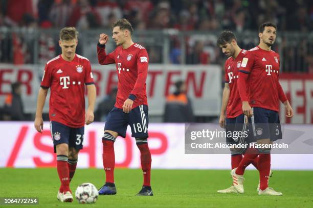 Joshua Kimmich, Leon Goretzka, Javier Martinez and Mats Hummels of Muenchen react after receiving the 3rd goal during the Bundesliga match between FC...