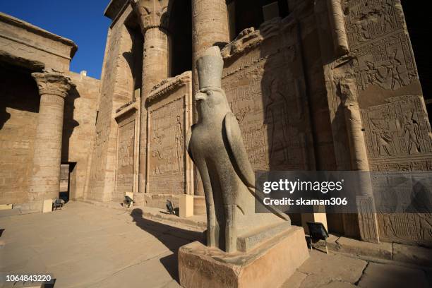 ruin stone carving god horus and osiris at edfu temple near nile river unesco site egypt - temple of luxor stock pictures, royalty-free photos & images