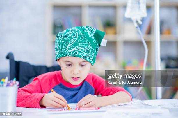 young boy with cancer drawing - arts patient stock pictures, royalty-free photos & images