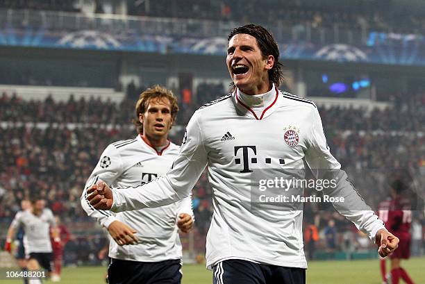 Mario Gomez of Bayern Muenchen celebrates after he scores his team's opening goal during the UEFA Champions League group E match between CFR 1907...