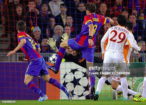 Roma's Brazilian goalkeeper Julio Sergio deflects a shot from FC Basel's forward Marco Streller during their group E UEFA Champions League football...