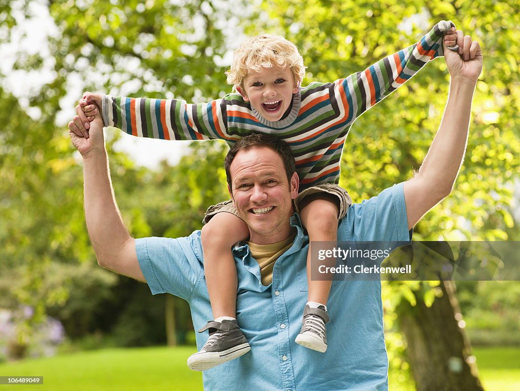 Father and son (4-5) enjoying at park, portrait