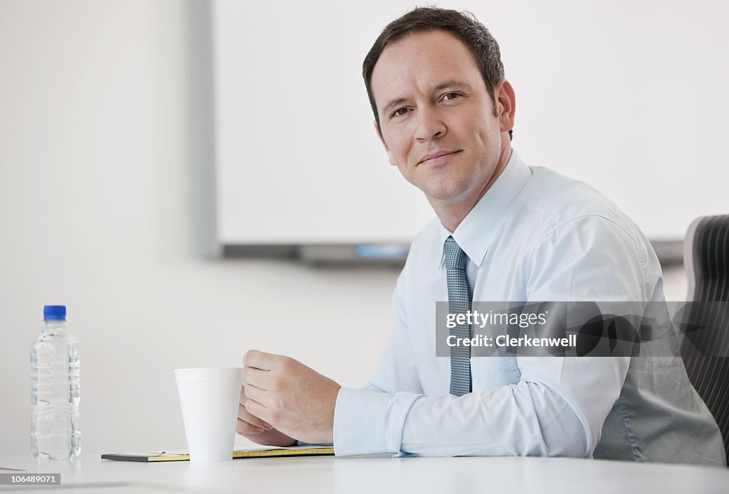 Portrait of a businessman sitting at office