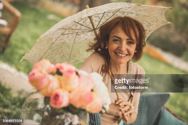 woman enjoying springtime - lace parasol stock pictures, royalty-free photos & images
