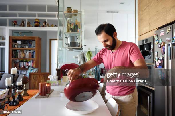 man cooking at home - messy cooking stock pictures, royalty-free photos & images