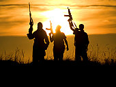soldiers against a sunset