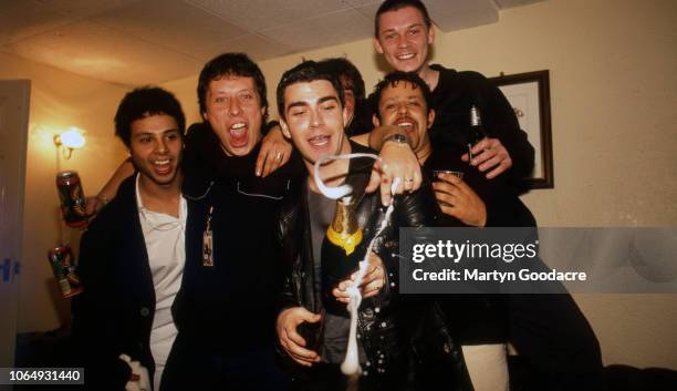 Welsh rock group Stereophonics, backstage with friends at Manchester Apollo, 1999. Stuart Cable second left, Kelly Jones front centre, Richard Jones...