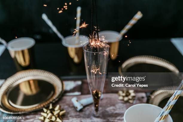 new years eve table with sparky lights - new year's eve dinner stock pictures, royalty-free photos & images