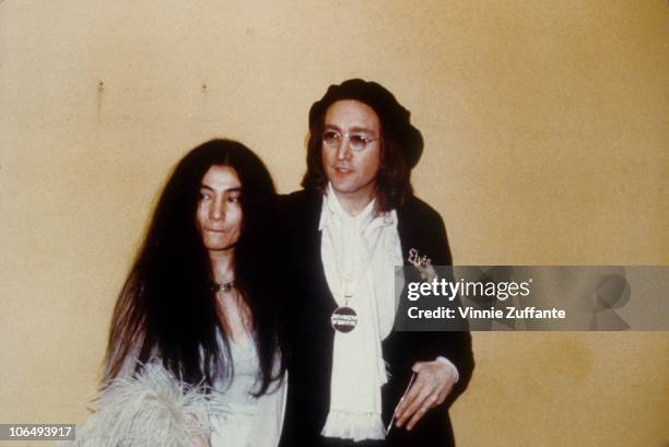 Former Beatle John Lennon and a pregnant Yoko Ono attend the 17th Annual Grammy Awards on March 1, 1975 at the Uris Theater in New York City, New...