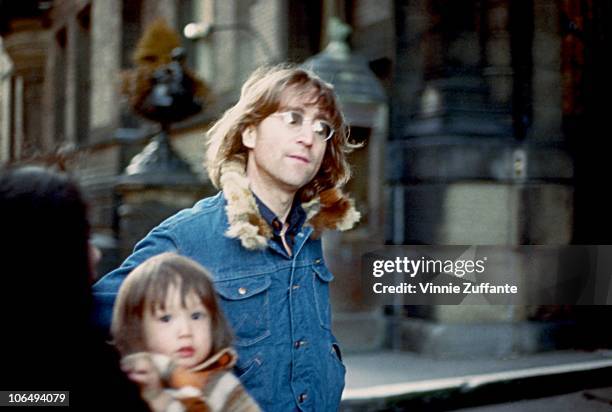 Former Beatle John Lennon poses for a photo with his wife Yoko Ono and son Sean Lennon, New York City, 1977.