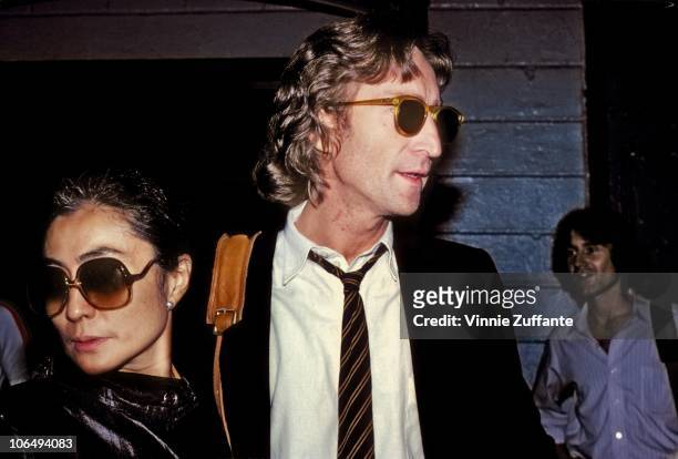 Former Beatle John Lennon and his wife Yoko Ono outside of the Times Square recording studio 'The Hit Factory' before a recording session of his...