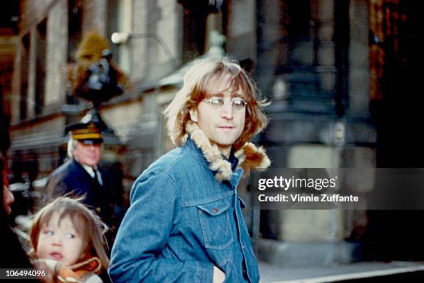 Former Beatle John Lennon poses for a photo with his wife Yoko Ono and son Sean Lennon in 1977 in New York City, New York.