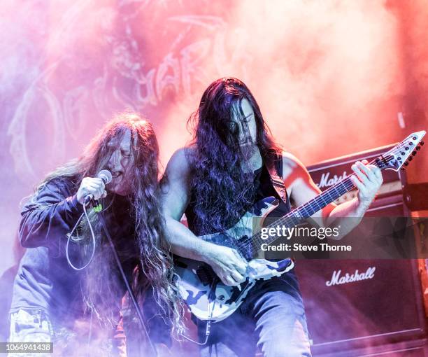 John Tardy and Kenny Andrews of Obituary perform at Arena Birmingham on November 7, 2018 in Birmingham, England.