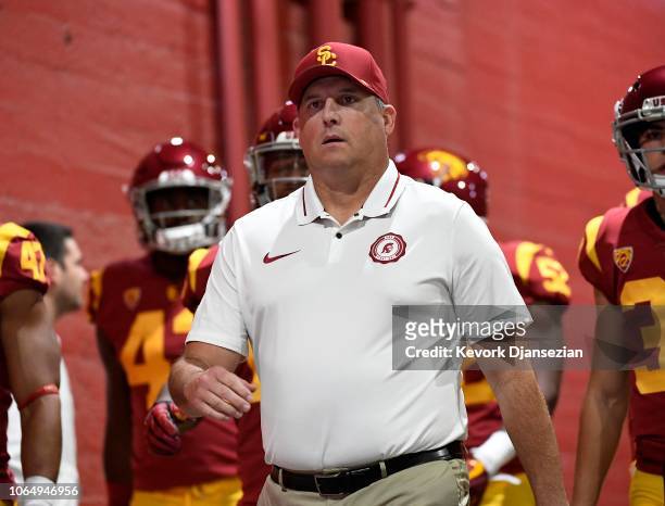Head coach Clay Helton of the USC Trojans walks his team down the tunnel at Los Angeles Memorial Coliseum to play against the Notre Dame Fighting...