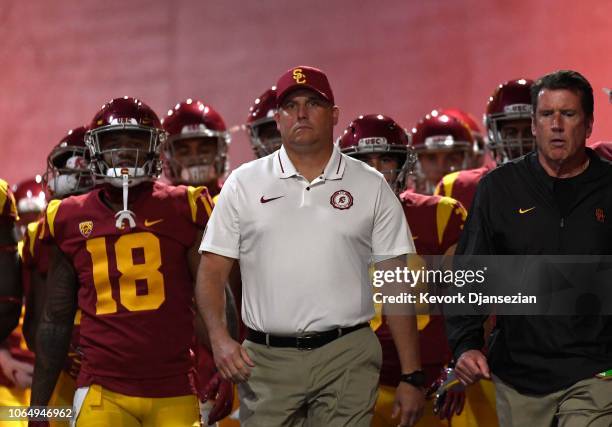 Head coach Clay Helton of the USC Trojans walks his team down the tunnel at Los Angeles Memorial Coliseum to play against the Notre Dame Fighting...