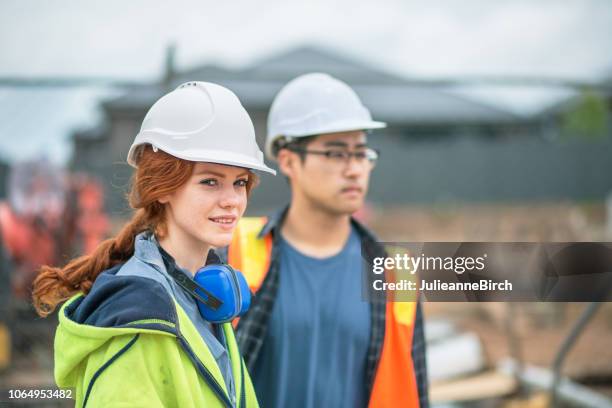 working outdoors in all weathers, tough work in construction industry - apprenticeship stock pictures, royalty-free photos & images