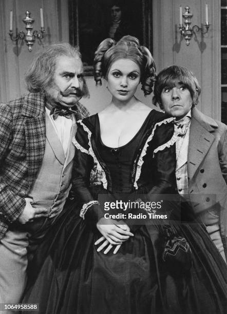 Actors Ronnie Barker, Ronnie Corbett and Madeline Smith wearing period costume in the 'classic serial' sketch from the television comedy series 'The...
