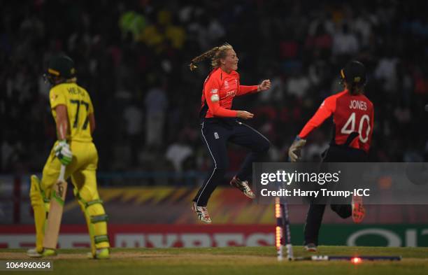 Sophie Ecclestone of England celebrates after dismissing Alyssa Healy of Australia during the ICC Women's World T20 2018 Final between Australia and...