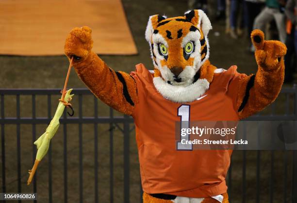 The mascot of the Clemson Tigers in action against the South Carolina Gamecocks during their game at Clemson Memorial Stadium on November 24, 2018 in...