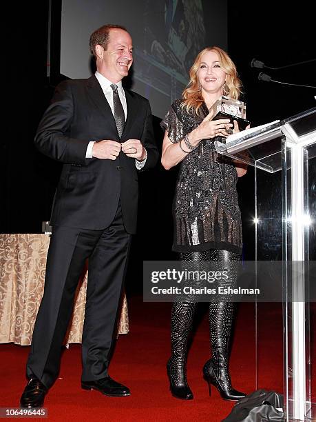 Madonna presents award to Honoree Neil Cole, Iconix Brand Chairman, CEO and President at the 5th Annual Fashion Delivers Gala at The Waldorf=Astoria...