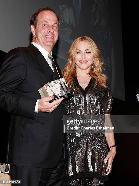 Madonna presents award to Honoree Neil Cole, Iconix Brand Chairman, CEO and President at the 5th Annual Fashion Delivers Gala at The Waldorf=Astoria...