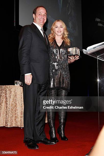 Madonna presents award to Honoree Neil Cole, Iconix Brand Chairman, CEO and President at the 5th Annual Fashion Delivers Gala at The Waldorf=Astoria...