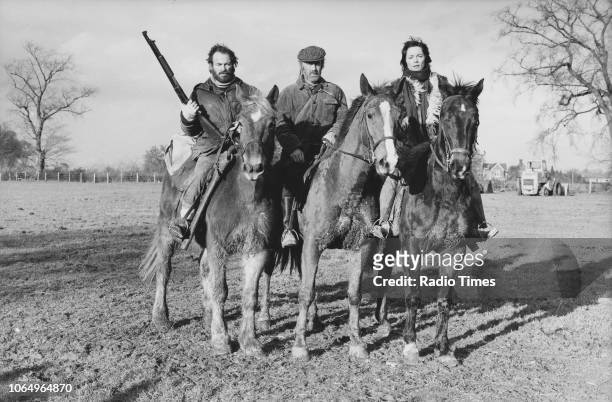Actors Dennis Lill, John Albineri and Lucy Fleming on horseback in a scene from episode 'Manhunt' of the television series 'Survivors', February 19th...