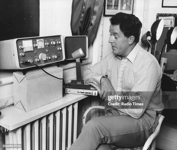 Actor Brian Rix pictured operating a ham radio, photographed for Radio Times in connection with the magazine's 'A Star with a Hobby' feature, October...