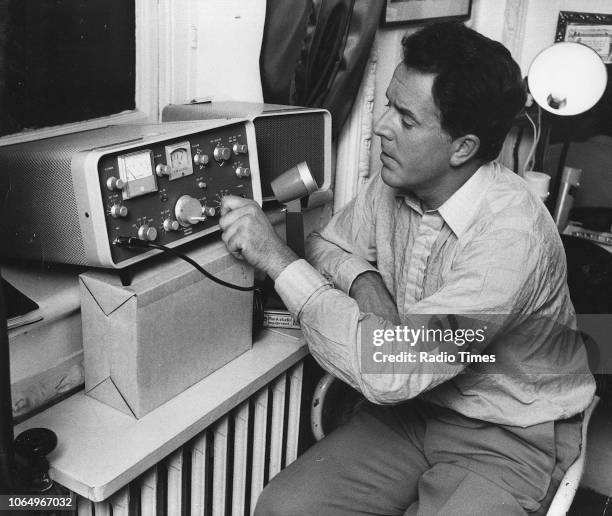 Actor Brian Rix pictured operating a ham radio, photographed for Radio Times in connection with the magazine's 'A Star with a Hobby' feature, October...