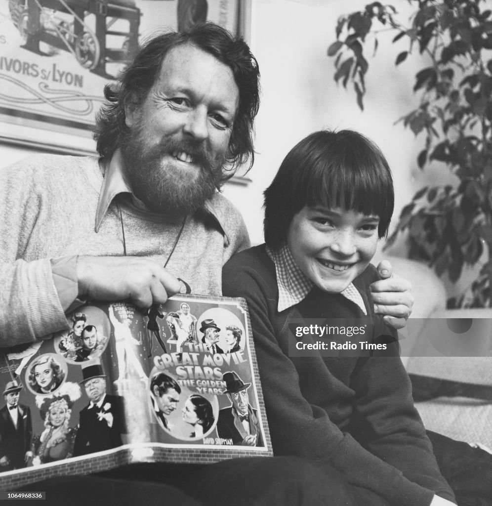 Willie Raston Portrait of comedian Willie Rushton and his son Toby reading 'The ...