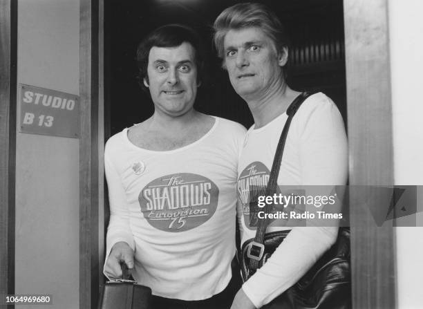 Television presenters Terry Wogan and Pete Murray wearing matching 'The Shadows Eurovision 75' outfits, photographed for Radio Times outside a BBC...