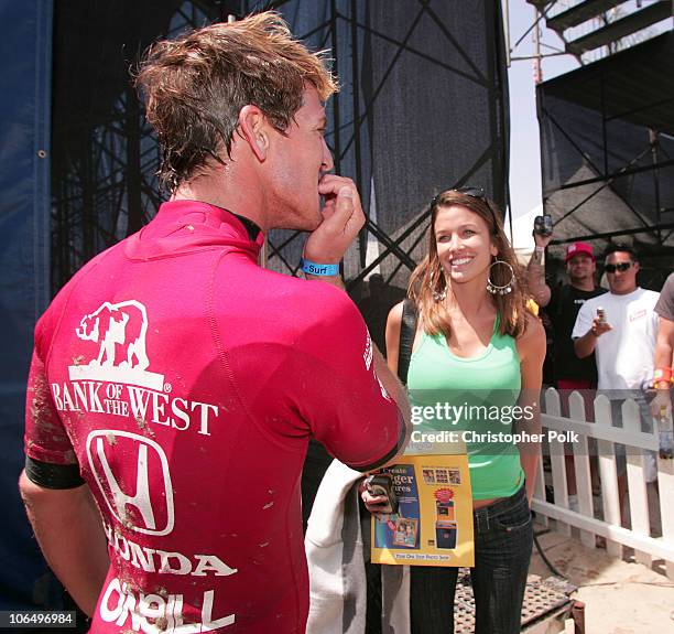Andy Irons celebrates with girlfirend, Lyndie Dupuis, after winning the Men's finals of the U.S. Open of Surfing in Huntington Beach, Calif., Sunday,...
