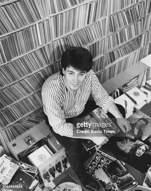 Portrait of of radio disc jockey Mike Read playing records, January 1989.