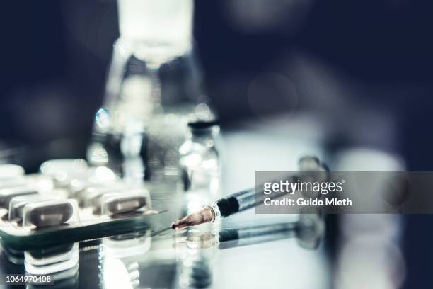 syringe, a vial and pills. - diabetes pills stock pictures, royalty-free photos & images