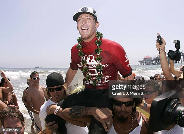 Andy Irons celebrates after winning the Men's finals of the U.S. Open of Surfing in Huntington Beach, Calif., Sunday, July 31, 2005.
