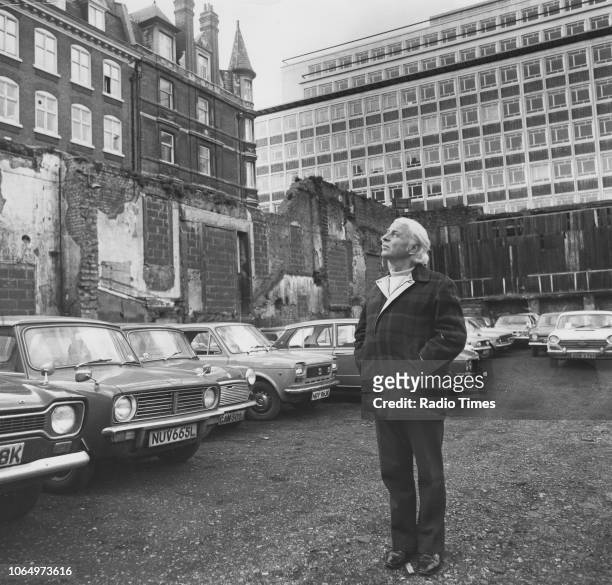 Portrait of actor Emlyn Williams standing within ruins near the Duchess Theatre, London, February 4th 1974.