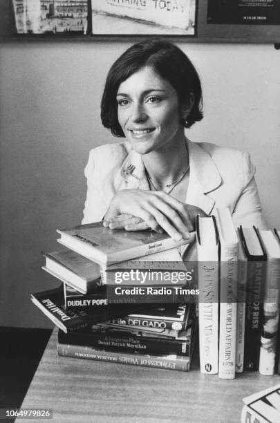 Portrait of actress Diana Quick with a pile of books, photographed at BBC Television Centre for Radio Times in connection with the television show...