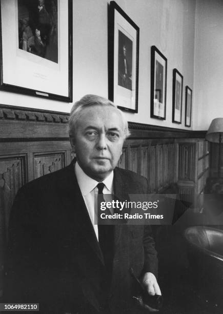 Portrait of Prime Minister Harold Wilson standing in a portrait gallery, circa 1975.