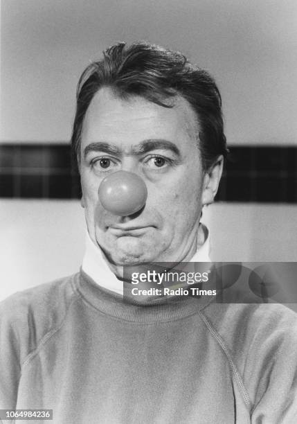 Portrait of comic actor Mike Yarwood wearing a false red nose, photographed for Radio Times in connection with the fund raising television special...