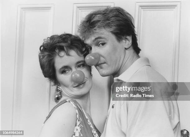 Actors Celia Imrie and Peter Howitt wearing false red noses, photographed for Radio Times in connection with the fund raising television special...