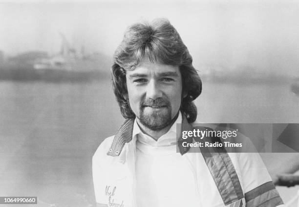 Portrait of television presenter Noel Edmonds standing next to the River Clyde in Glasgow, Scotland, February 1978.